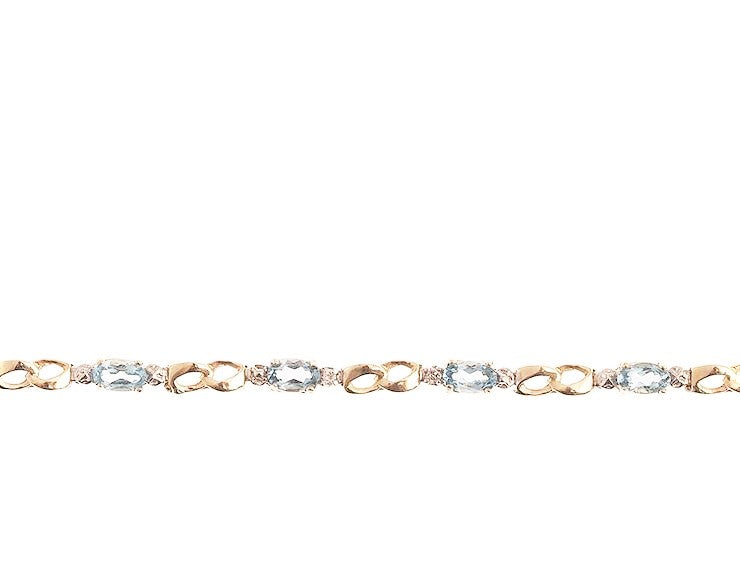 Beautifully Designed 10kt. Gold Bracelet. This design is mounted with Aquamarine Gemstones, and is accented with Diamonds. The gemstones are approximately 2.30ctw., and the diamonds are approximately 0.02ctw., of I clarity and H-I Color 