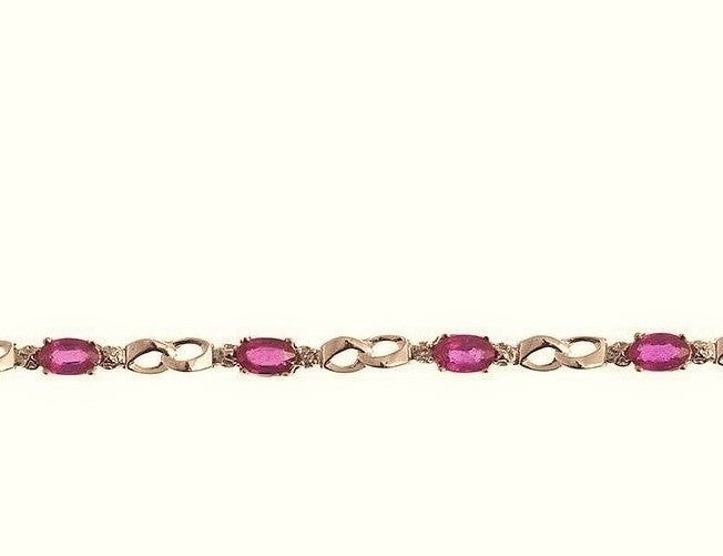 Beautifully Designed 10kt. Gold Bracelet. This design is mounted with Ruby Gemstones, and is accented with Diamonds. The gemstones are approximately 2.30ctw., and the diamonds are approximately 0.02ctw., of I clarity and H-I Color This Bracelet measures approximately 7 inches in length.  For further customization options not shown, please contact us prior to placing your order.  